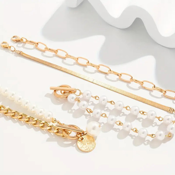 Chic Gold Bracelet Set (4 pieces) – Snake, Pearls, and Links