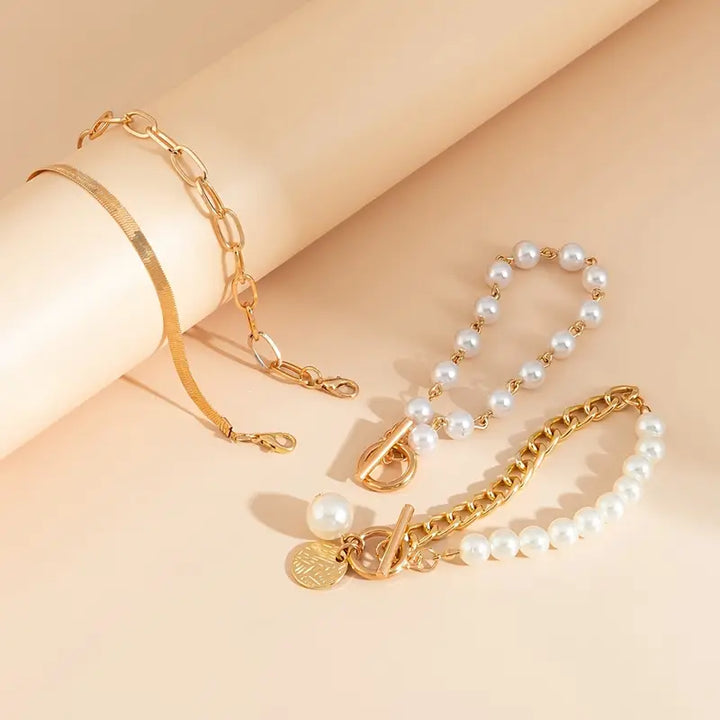 Chic Gold Bracelet Set (4 pieces) – Snake, Pearls, and Links