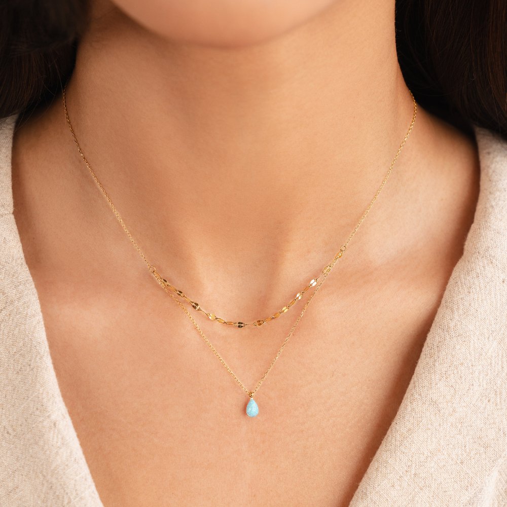 Layered necklace with a blue opal teardrop