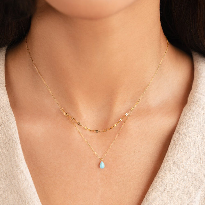Layered necklace with a blue opal teardrop